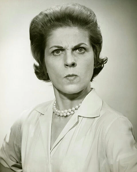 Angry woman in studio, (B&W), (Portrait)