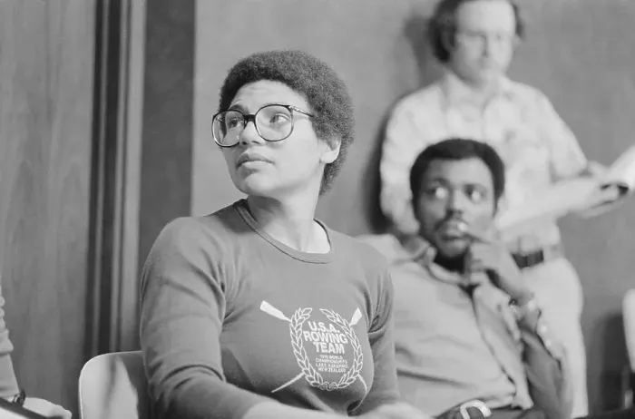 Framed Print : Anita DeFranz Sitting and Wearing Eyeglasses Framed Print : Anita DeFranz Sitting and Wearing Eyeglasses
