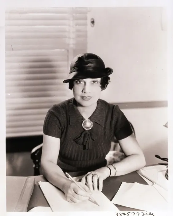 Framed Print : Anita Loos Looks Up from Desk