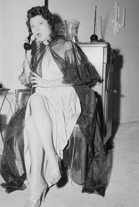 Framed Print : Ann Corio Holding a Phone