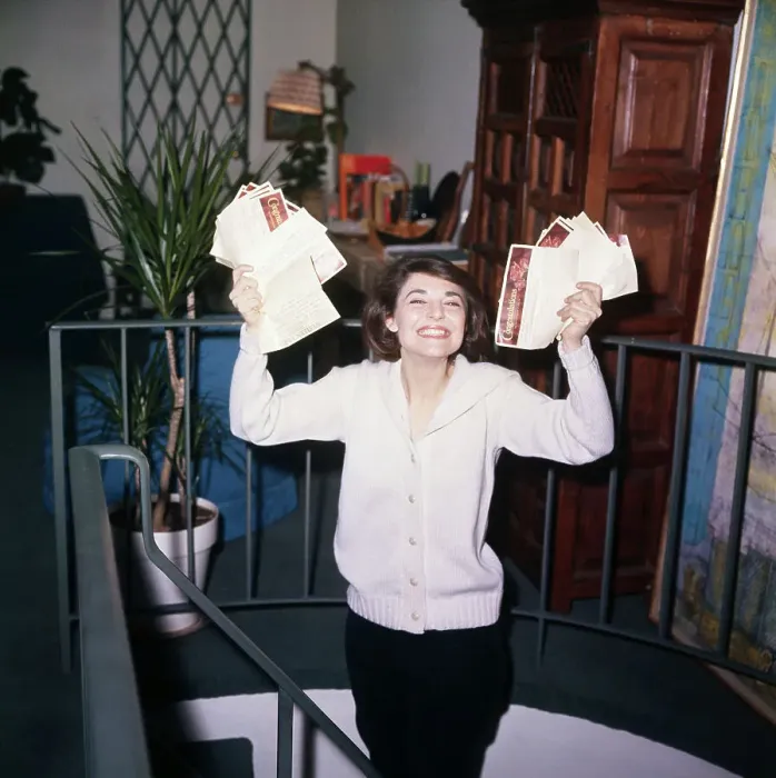 Framed Print : Anne Bancroft Holding Documents and Smiling