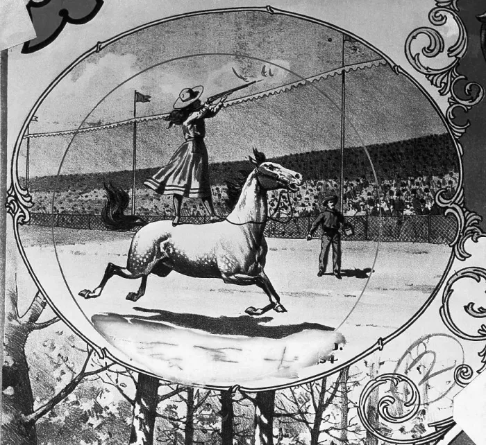 Framed Print : Annie Oakley Shooting From Horseback