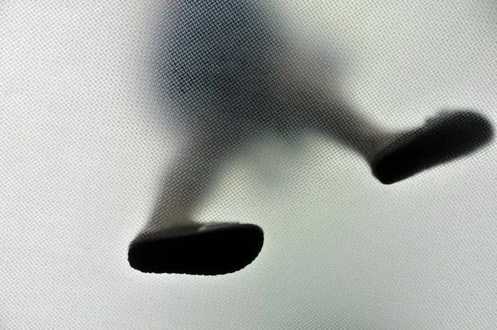 Framed Print : Anonymous walking person from below