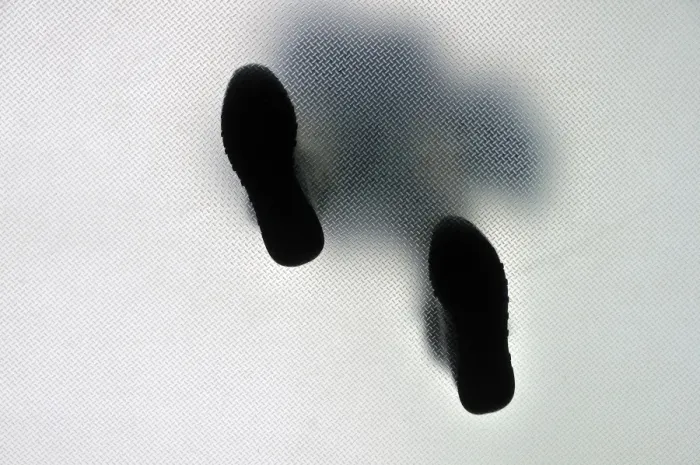 Framed Print : Anonymous walking person from below
