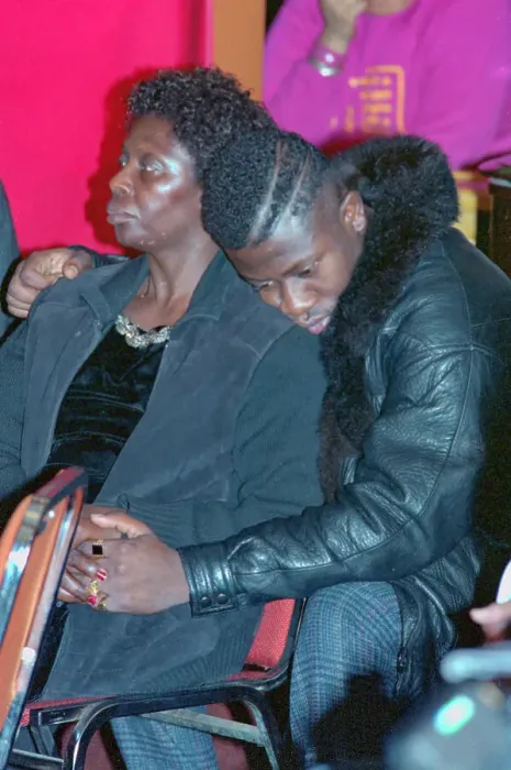 Framed Print : Anthony Griffith Consoling His Mother Framed Print : Anthony Griffith Consoling His Mother