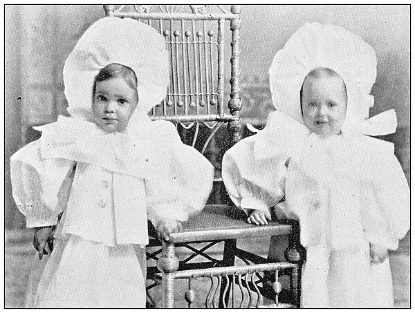 Antique photograph from Lawrence, Kansas, in 1898: Twins, Albert and Nellie