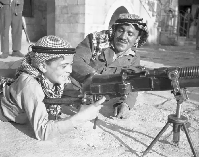 Framed Print : Arab Boy Learning About Machine Gun