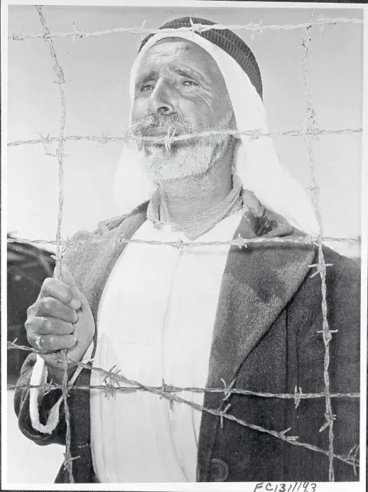 Framed Print : Arab Man Behind a Barbed Wire on Gaza Strip Framed Print : Arab Man Behind a Barbed Wire on Gaza Strip
