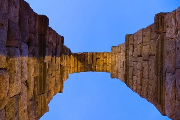An Arch of Aqueduct of Segovia against blue sky