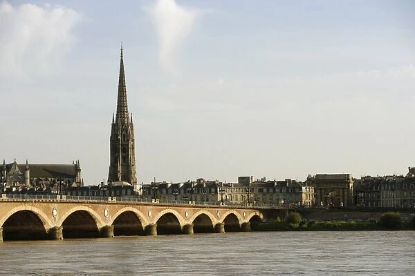 Arch bridge across a river, Pont de Pierre, St. Michel Basilica, Garonne River, Bordeaux, Aquitaine, France