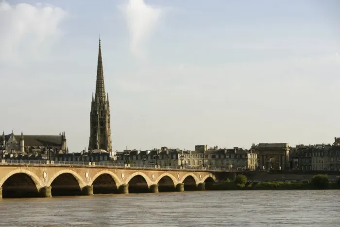 Framed Print : Arch bridge across a river, Pont de Pierre, St. Michel Basilica, Garonne River, Bordeaux, Aquitaine, France