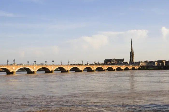Framed Print : Arch bridge across a river, Pont De Pierre, St. Michel Basilica, Garonne River, Bordeaux, Aquitaine, France