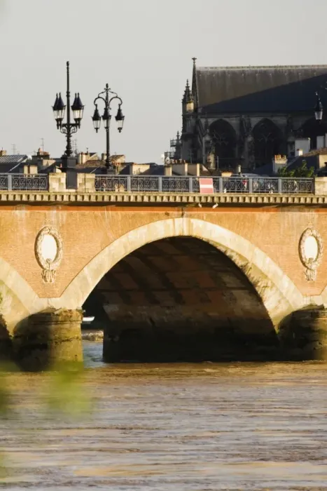 Framed Print : Arch bridge across a river, Pont De Pierre, St. Michel Basilica, Garonne River, Bordeaux, Aquitaine, France