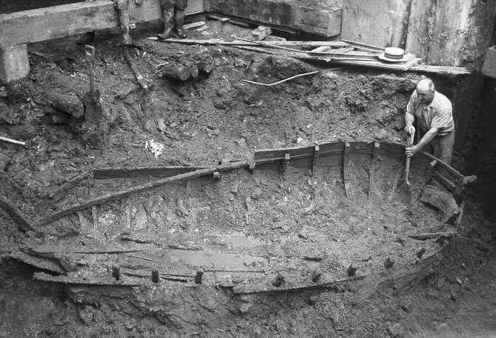 Framed Print : Archaeologist Digging Around Boat Framed Print : Archaeologist Digging Around Boat