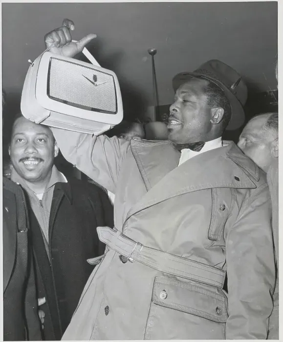 Framed Print : Archie Moore Holding Radio Framed Print : Archie Moore Holding Radio