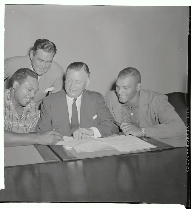 Framed Print : Archie Moore Signing His Contract Framed Print : Archie Moore Signing His Contract
