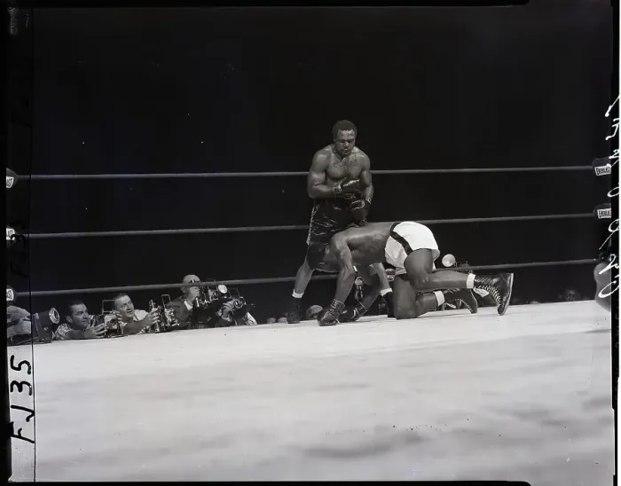 Framed Print : Archie Moore Standing Over Patterson Framed Print : Archie Moore Standing Over Patterson