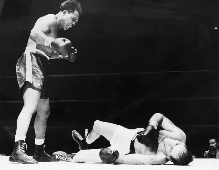 Framed Print : Archie Moore Stands Over Opponent In Ring