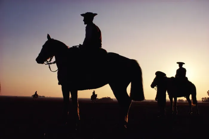 Framed Print : Argentina, horsemen in landscape, silhouette, sunset Framed Print : Argentina, horsemen in landscape, silhouette, sunset