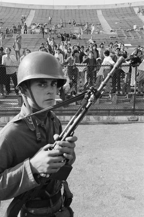 Framed Print : Armed Guard with Prisoners in Stadium