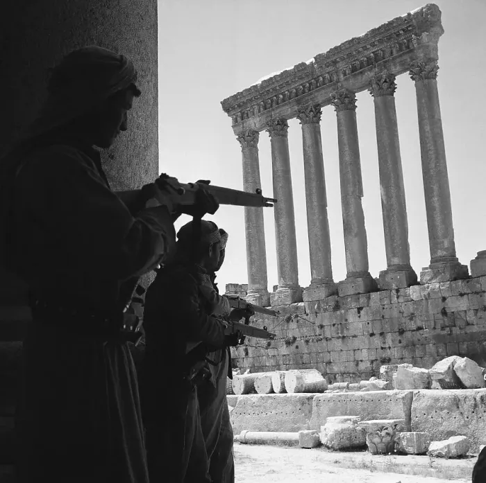Framed Print : Armed Rebels Take Cover in Ruins Framed Print : Armed Rebels Take Cover in Ruins