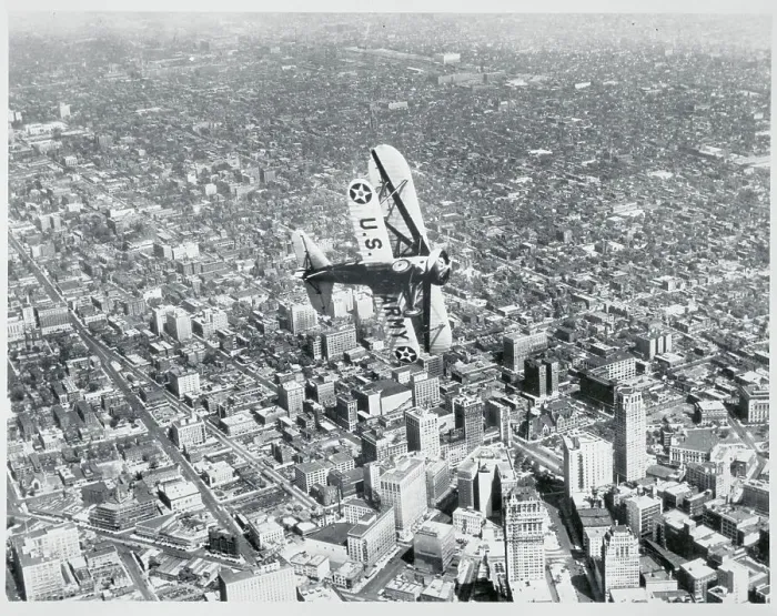 Framed Print : Army Airplane Flying Above City Framed Print : Army Airplane Flying Above City