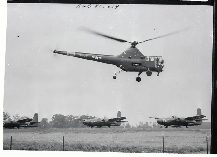 Framed Print : Army Helicopter Hovering Over Waiting Planes Framed Print : Army Helicopter Hovering Over Waiting Planes