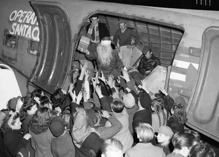 Framed Print : Army Santa Gives Gifts Out of Plane Framed Print : Army Santa Gives Gifts Out of Plane