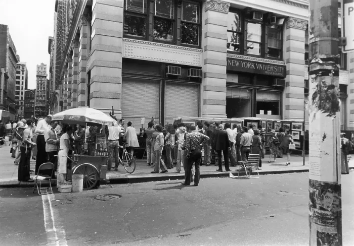 Framed Print : Art Show. New Yorkers viewing an art exhibition outside a New York University Framed Print : Art Show. New Yorkers viewing an art exhibition outside a New York University