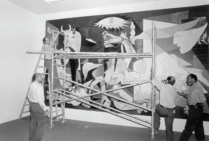 Framed Print : Art Handlers Taking Down Guernica by Pablo Picasso Framed Print : Art Handlers Taking Down Guernica by Pablo Picasso