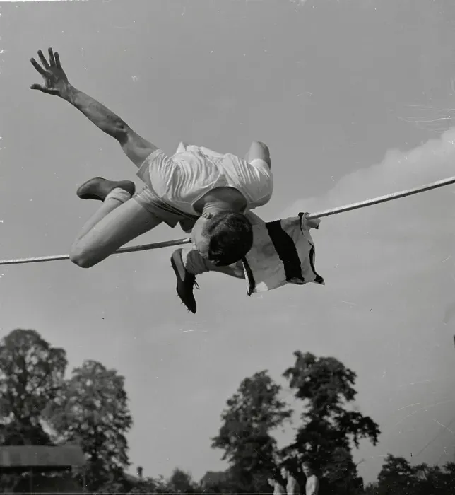 Framed Print : Art Jackes Straddling High Bar During Jump Framed Print : Art Jackes Straddling High Bar During Jump
