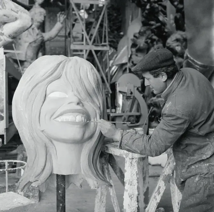 Framed Print : Artist Painting Papier Mache Head of Brigitte Bardot Framed Print : Artist Painting Papier Mache Head of Brigitte Bardot