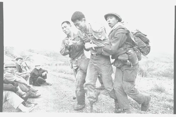Framed Print : ARVN Soldiers Aiding A Comrade Framed Print : ARVN Soldiers Aiding A Comrade