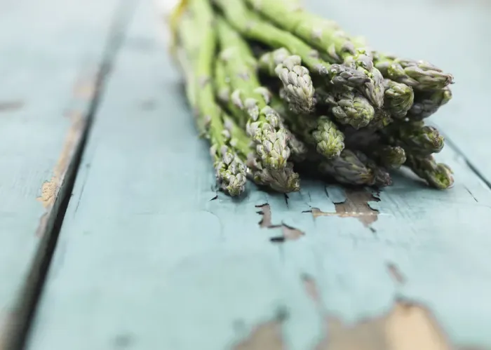 Framed Print : Asparagus photographed against a painted green wood background Framed Print : Asparagus photographed against a painted green wood background