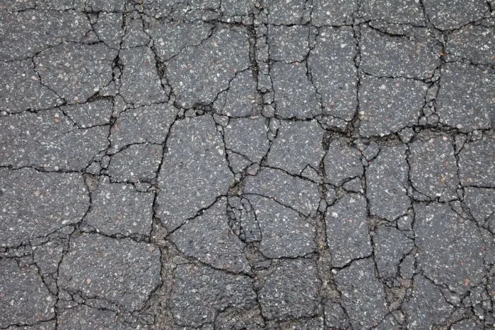 Framed Print : Asphalt cracked by frost and cold, potholes in Berlin, Germany, Europe Framed Print : Asphalt cracked by frost and cold, potholes in Berlin, Germany, Europe
