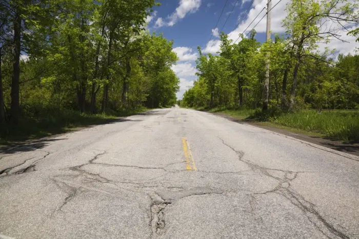 Framed Print : Asphalt road with pothole in the countryside, Quebec, Canada Framed Print : Asphalt road with pothole in the countryside, Quebec, Canada