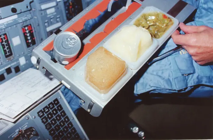 Framed Print : Astronaut with Tray of Columbia Food Framed Print : Astronaut with Tray of Columbia Food