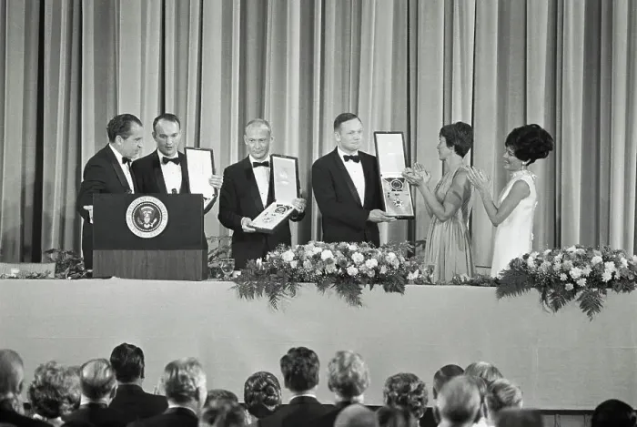 Framed Print : Astronauts Displaying Awards