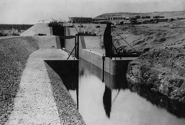 Aswan Dam. circa 1902: Entrance to locks on the Aswan Dam going downstream