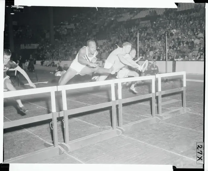 Framed Print : Athletes Jumping over Hurdles Framed Print : Athletes Jumping over Hurdles