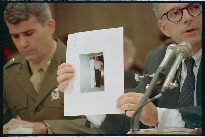 Framed Print : Attorney Holding Photo in Court Framed Print : Attorney Holding Photo in Court