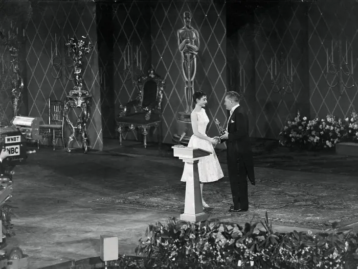 Framed Print : Audrey Hepburn Accepting Oscar from Jean Hersholt Framed Print : Audrey Hepburn Accepting Oscar from Jean Hersholt