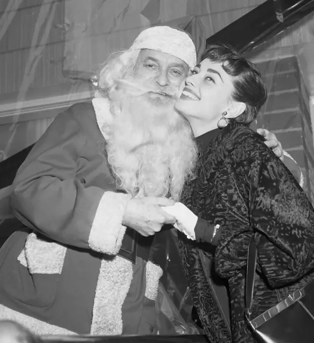 Framed Print : Audrey Hepburn Cheek to Cheek with Santa Claus Framed Print : Audrey Hepburn Cheek to Cheek with Santa Claus