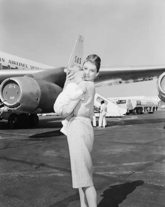 Framed Print : Audrey Hepburn Holding Baby Son Sean Near Airplane Framed Print : Audrey Hepburn Holding Baby Son Sean Near Airplane
