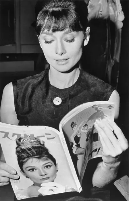 Framed Print : Audrey Hepburn Holding Japanese Magazine with Her Picture Framed Print : Audrey Hepburn Holding Japanese Magazine with Her Picture