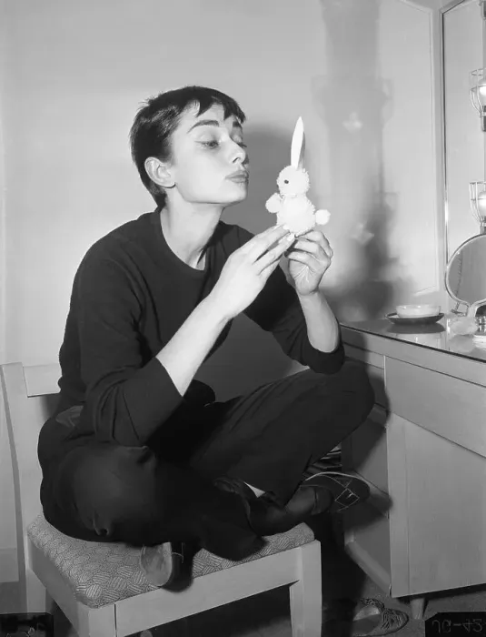 Framed Print : Audrey Hepburn Holding Small Rabbit Charm Framed Print : Audrey Hepburn Holding Small Rabbit Charm