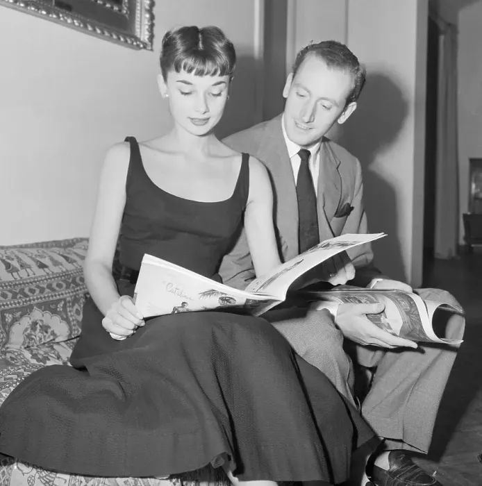 Framed Print : Audrey Hepburn and James Hanson Reading Magazines Framed Print : Audrey Hepburn and James Hanson Reading Magazines