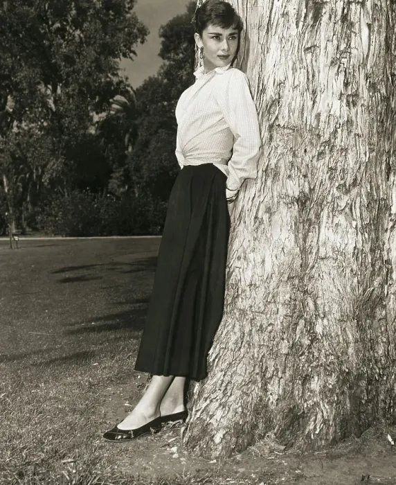 Framed Print : Audrey Hepburn Leaning on Tree Trunk Framed Print : Audrey Hepburn Leaning on Tree Trunk
