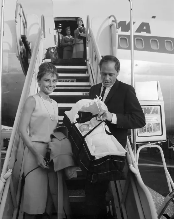 Framed Print : Audrey Hepburn and Mel Ferrer Walking From Airplane With Their Baby Framed Print : Audrey Hepburn and Mel Ferrer Walking From Airplane With Their Baby