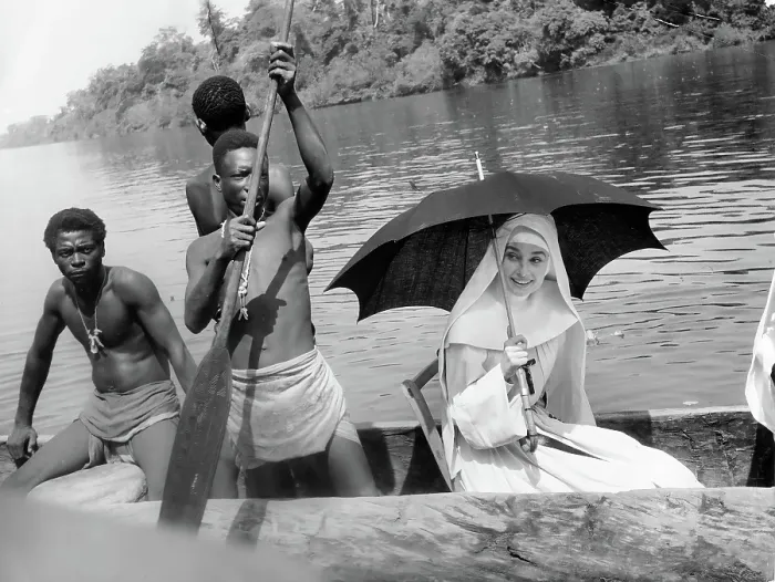 Framed Print : Audrey Hepburn With Natives On Canoe Framed Print : Audrey Hepburn With Natives On Canoe
